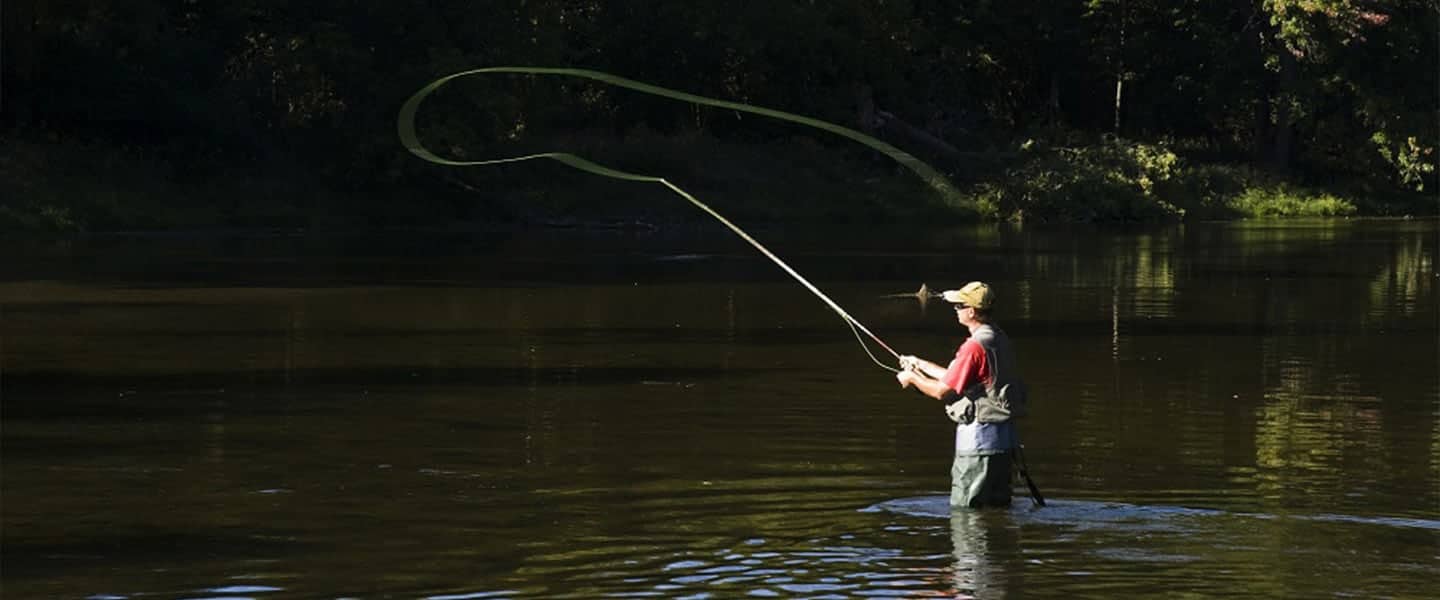 Fisherman in northern Michigan river